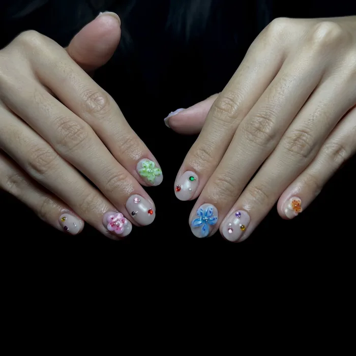 A summer set with 3D flowers in pink, green and blue over a sheer base